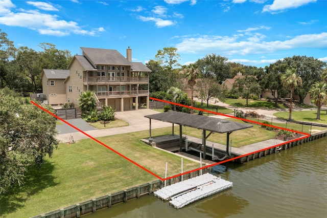 dock area featuring a yard, a water view, and a balcony