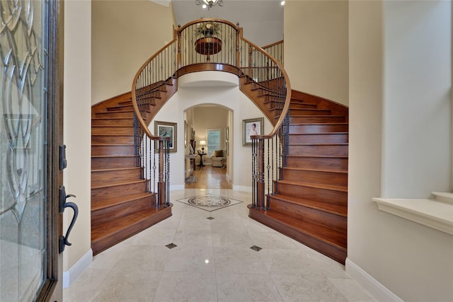 foyer with a towering ceiling