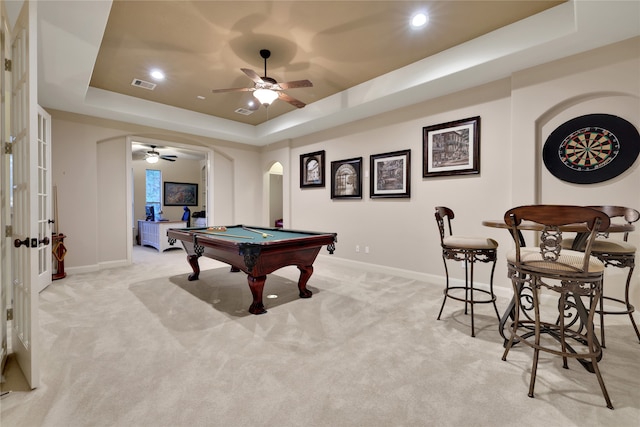 playroom featuring ceiling fan, a tray ceiling, light carpet, and pool table