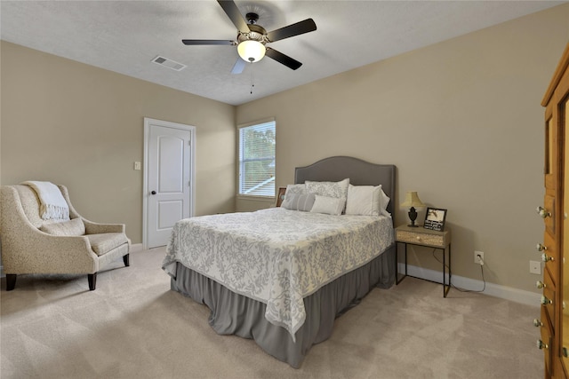 bedroom with light colored carpet and ceiling fan