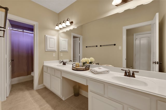 bathroom featuring a shower with shower curtain, vanity, toilet, and tile patterned floors