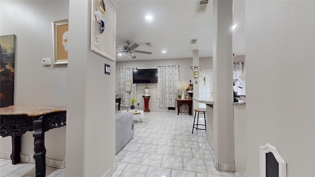 corridor with light tile patterned floors