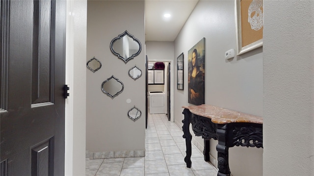 hall with light tile patterned floors