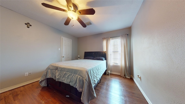 bedroom featuring hardwood / wood-style floors and ceiling fan