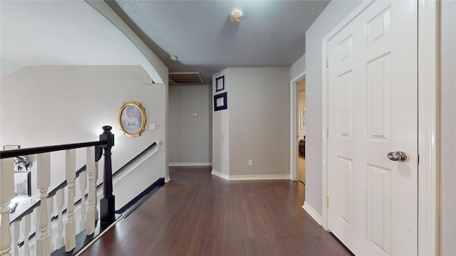 hall with dark hardwood / wood-style flooring