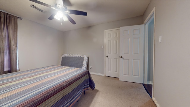 carpeted bedroom with a closet and ceiling fan