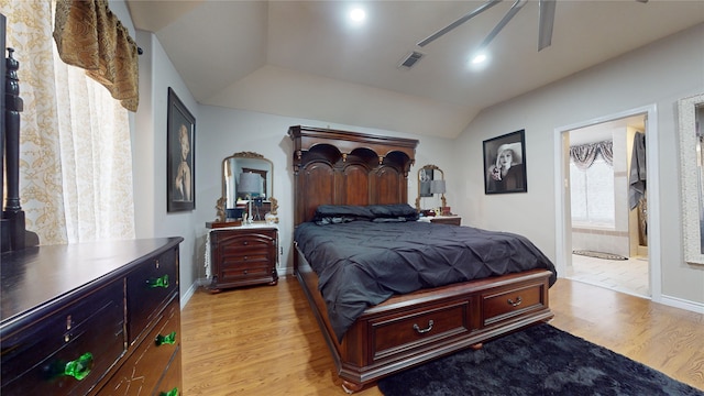 bedroom with connected bathroom, light hardwood / wood-style flooring, and ceiling fan