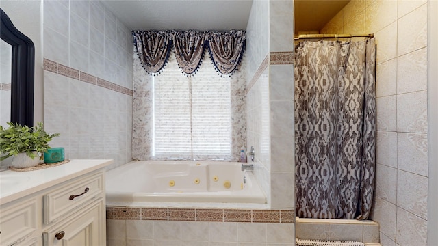 bathroom featuring vanity and tile walls