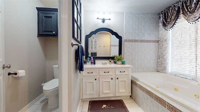 bathroom featuring tile patterned flooring, tiled bath, toilet, and vanity