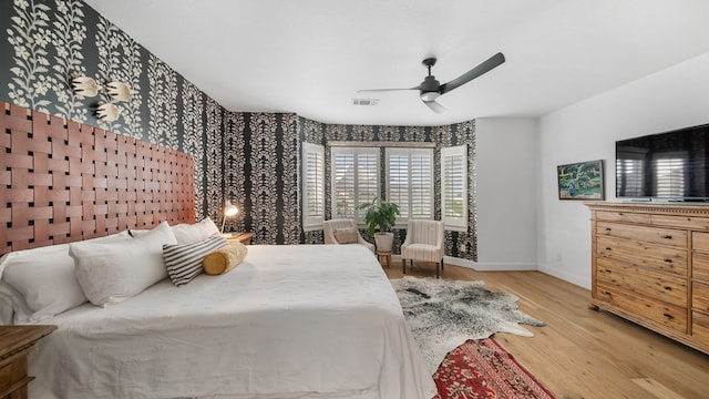 bedroom featuring light hardwood / wood-style flooring and ceiling fan