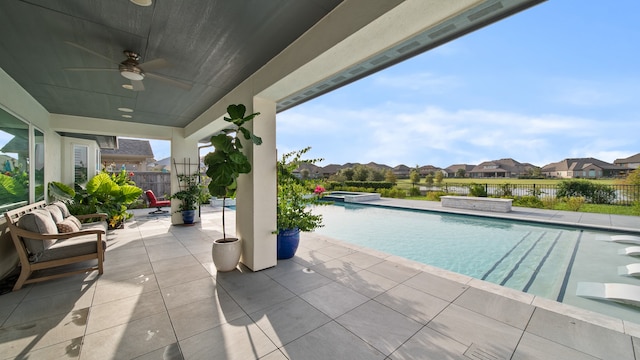 view of pool featuring a patio and ceiling fan