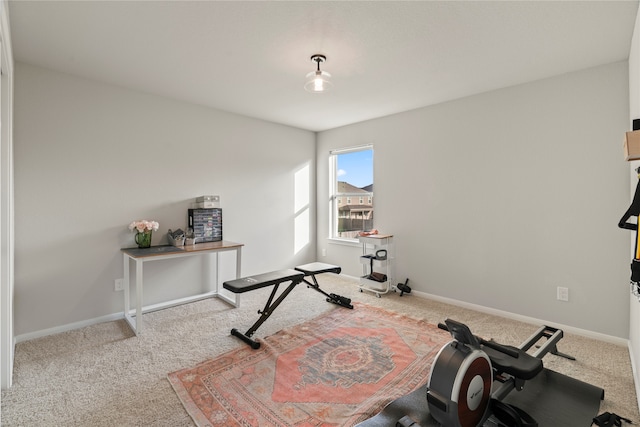 exercise room with light colored carpet