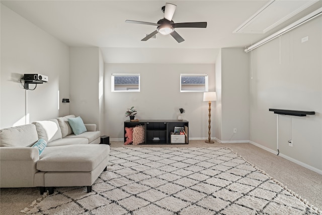 living room with light colored carpet and ceiling fan