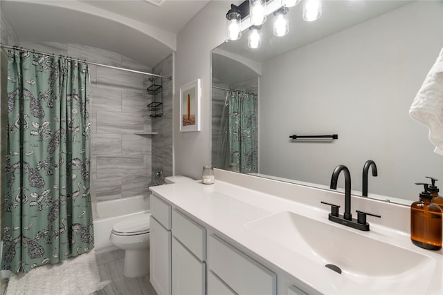 full bathroom featuring vanity, toilet, tile patterned flooring, and shower / tub combo