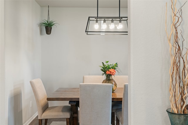 dining space with hardwood / wood-style floors