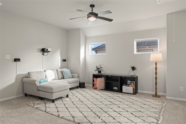 living room with light colored carpet and ceiling fan