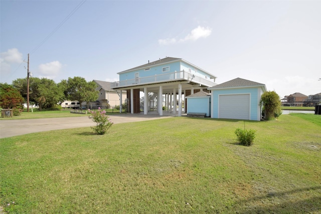 back of house with a carport and a yard