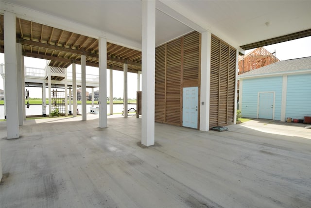 view of patio with a water view