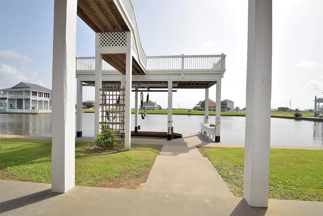 view of patio / terrace featuring a water view and a dock