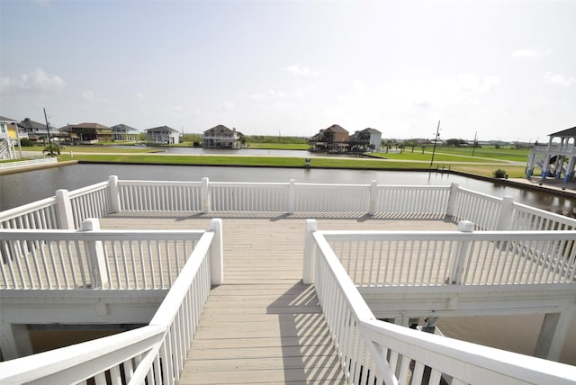 wooden deck featuring a water view