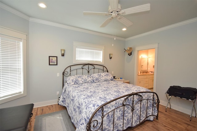 bedroom with multiple windows, wood-type flooring, ornamental molding, and ceiling fan