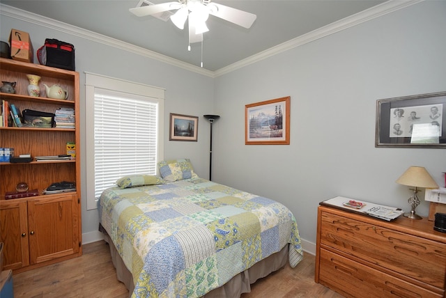 bedroom featuring crown molding, ceiling fan, and light hardwood / wood-style floors