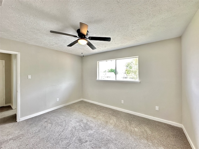 carpeted empty room featuring a textured ceiling and ceiling fan