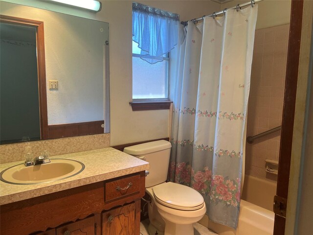 full bathroom with toilet, vanity, and shower / bathtub combination with curtain