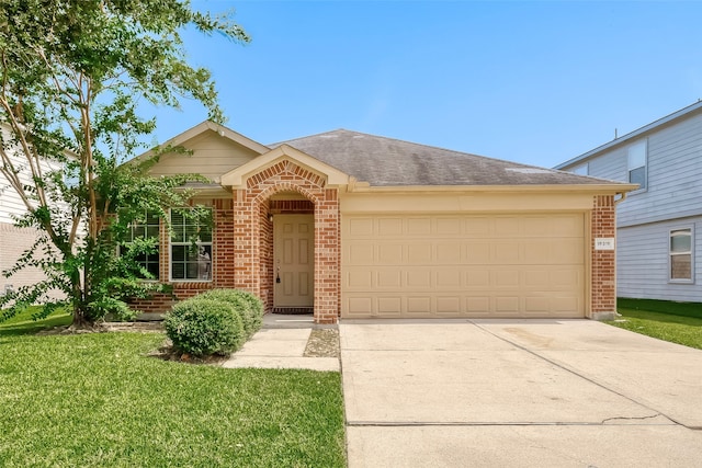 ranch-style home with a garage and a front yard