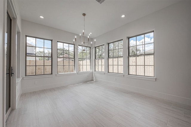 interior space featuring an inviting chandelier and plenty of natural light