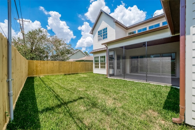 view of yard featuring a sunroom