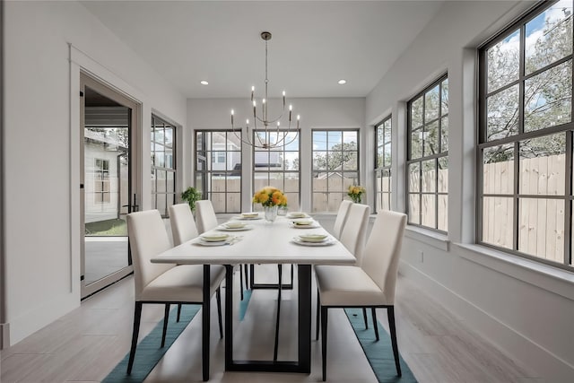 sunroom with an inviting chandelier and a wealth of natural light