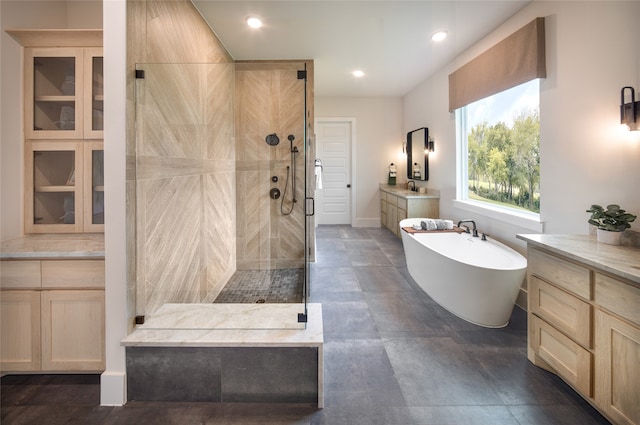 bathroom with vanity, shower with separate bathtub, and tile patterned flooring