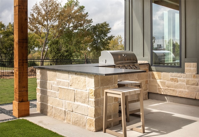 view of patio / terrace with exterior kitchen and area for grilling