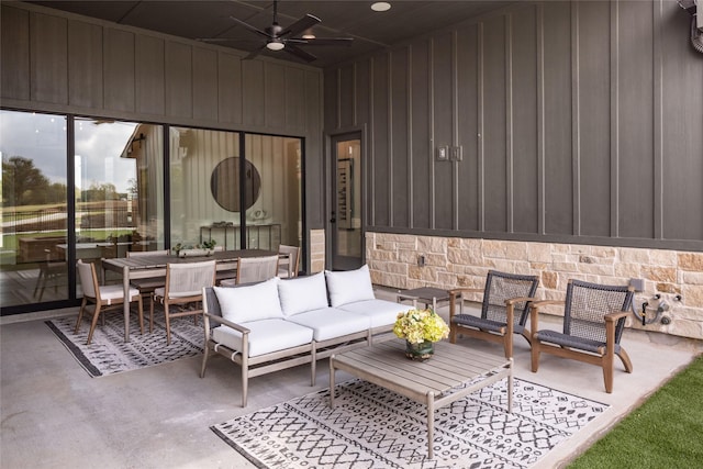 view of patio with a ceiling fan, outdoor dining area, and an outdoor hangout area