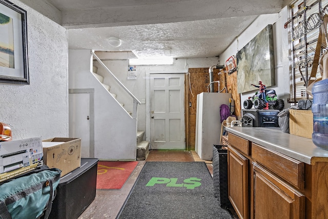 interior space featuring separate washer and dryer and a textured ceiling