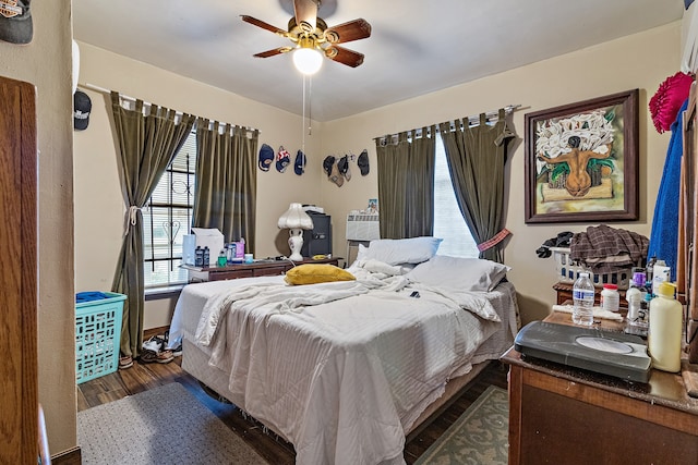 bedroom featuring dark hardwood / wood-style floors and ceiling fan