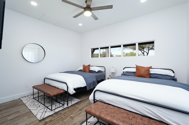 bedroom with ceiling fan and wood-type flooring