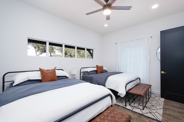 bedroom featuring ceiling fan and hardwood / wood-style flooring