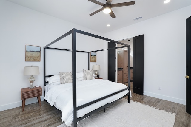 bedroom featuring wood-type flooring and ceiling fan