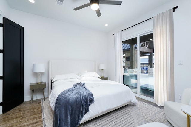 bedroom featuring wood-type flooring, ceiling fan, and access to exterior