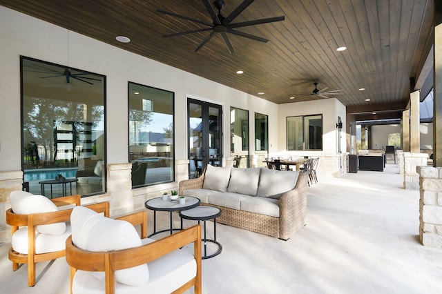 exterior space featuring an outdoor hangout area and ceiling fan