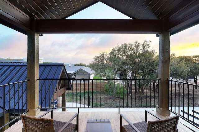 view of balcony at dusk