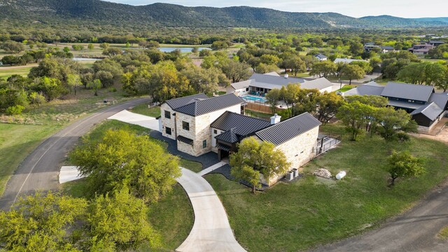 birds eye view of property with a mountain view