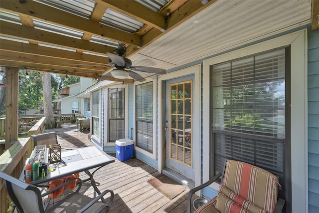 wooden deck featuring ceiling fan