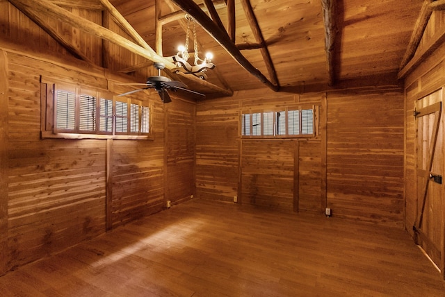 interior space featuring wood ceiling and wooden walls