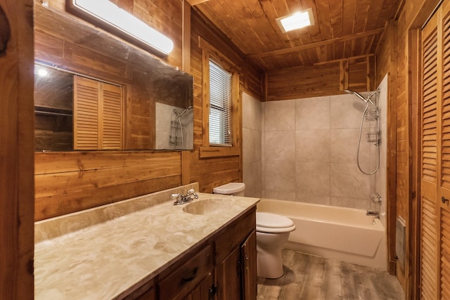 bathroom featuring toilet, wooden ceiling, wood finished floors, vanity, and a closet