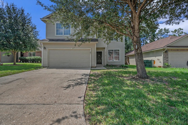 view of front of home featuring a garage and a front yard