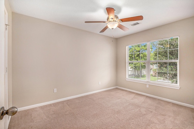 empty room with light carpet and ceiling fan