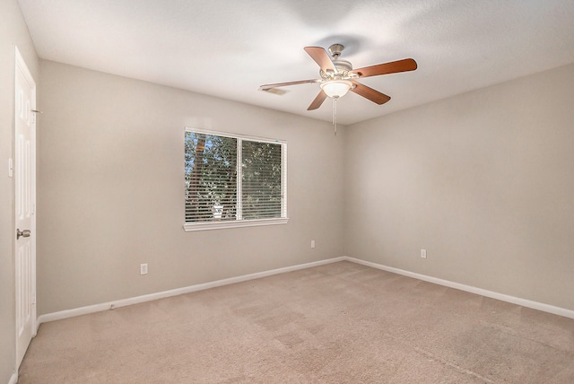 unfurnished room with carpet floors and ceiling fan